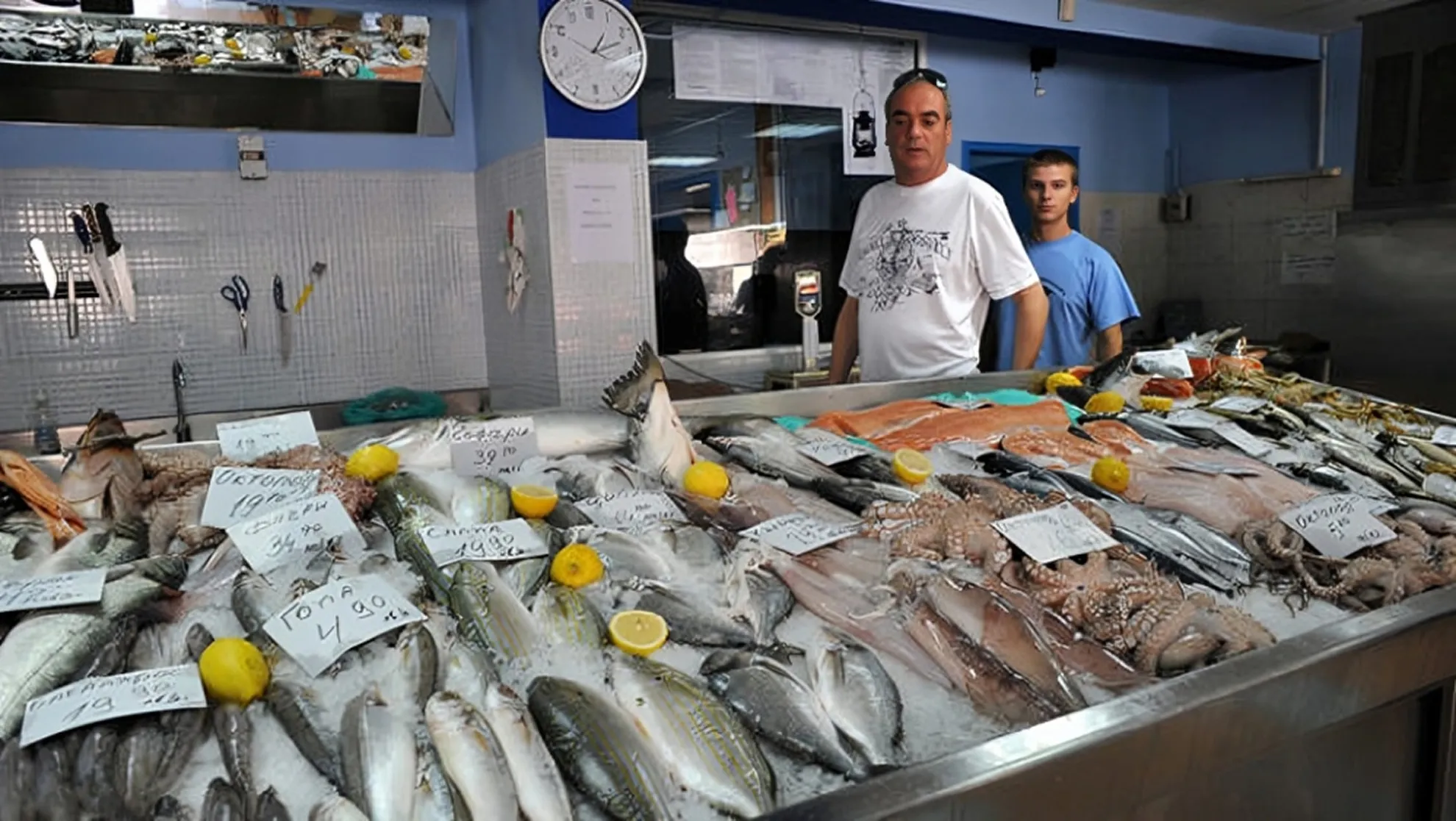 Haris Afentakis standing in front of his Greek fish store on Doyran 9A, Sofia, in 2010